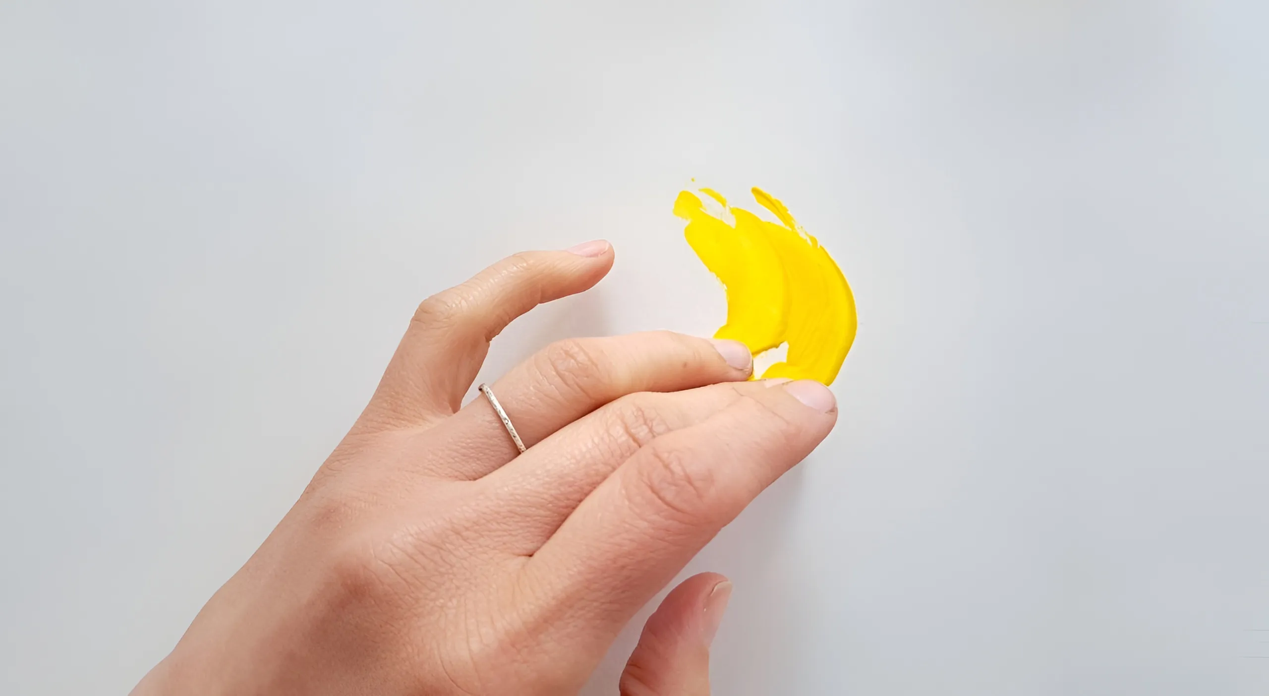 Hands with yellow element